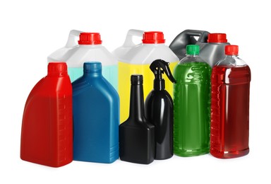 Photo of Many bottles and canisters with liquids on white background