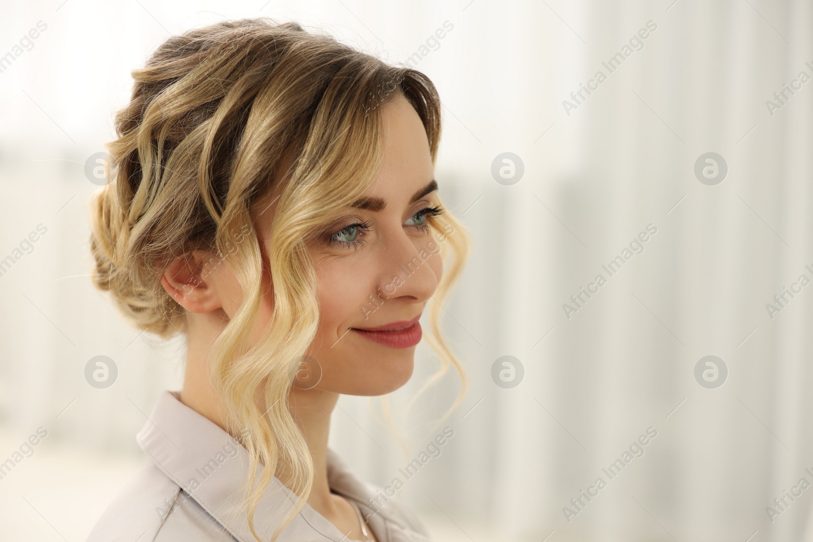 Photo of Woman with beautiful hair style indoors. Space for text