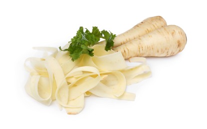 Photo of Whole and sliced fresh ripe parsnip with leaves on white background