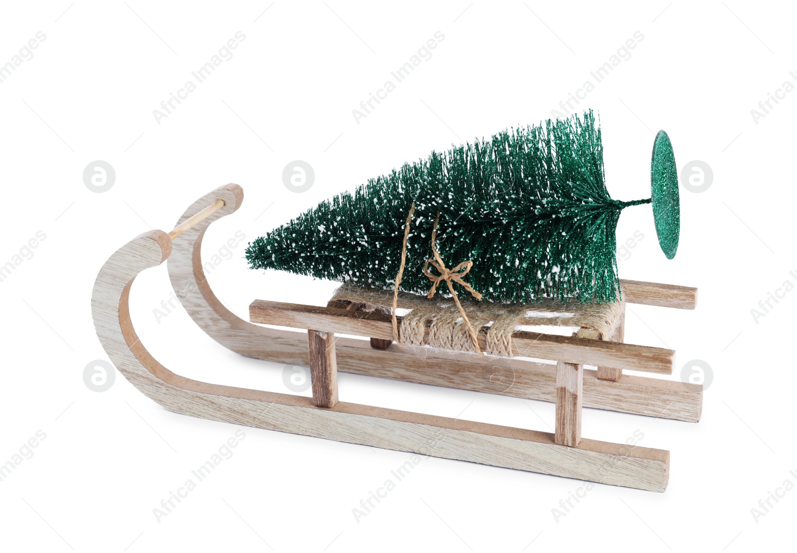 Photo of Sleigh with decorative Christmas tree isolated on white