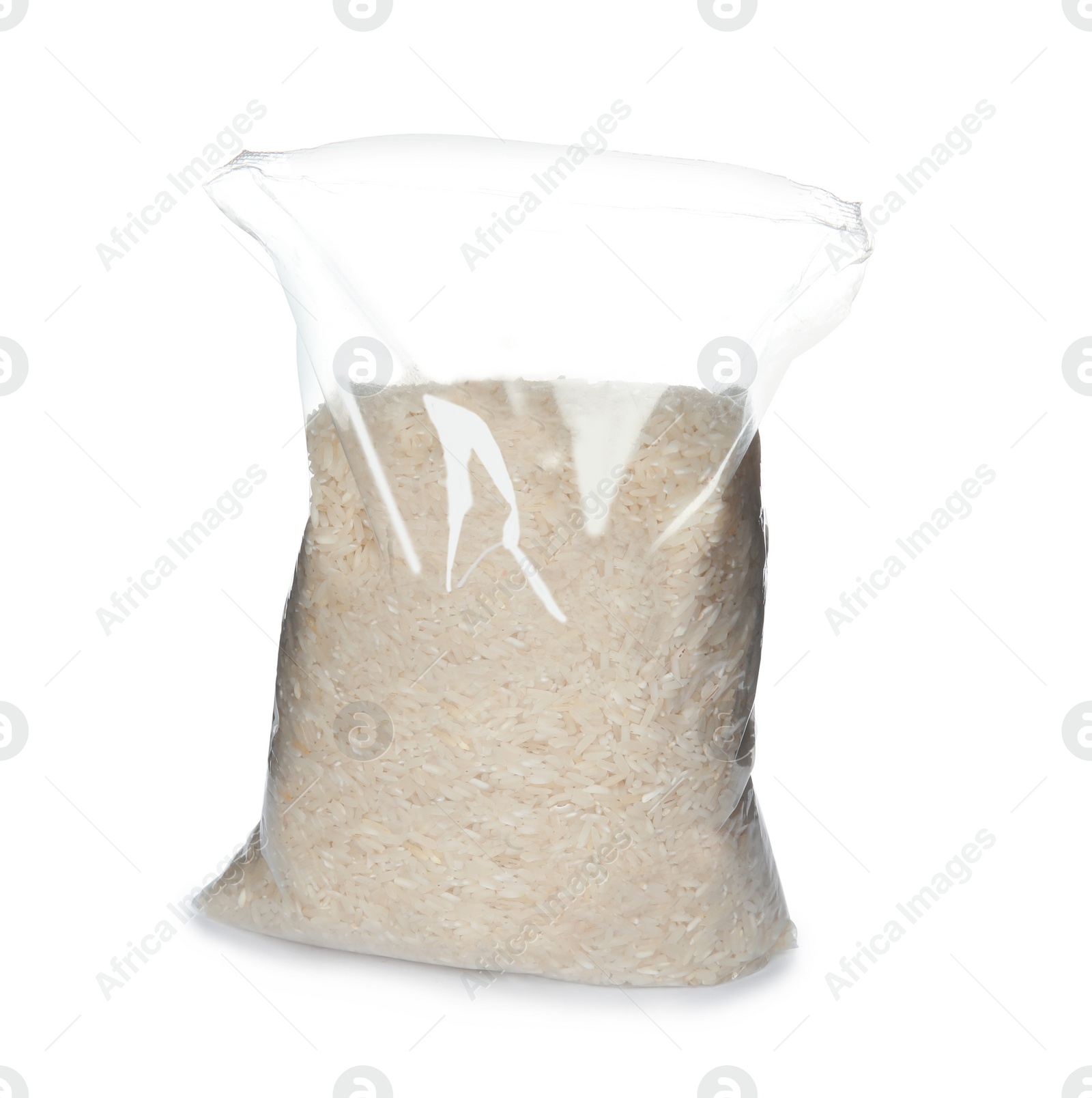 Photo of Plastic bag with uncooked rice on white background