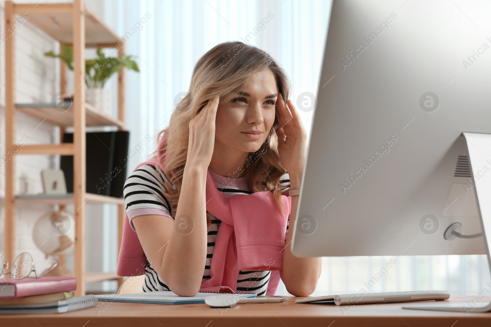 Photo of Online test. Woman studying with computer at home