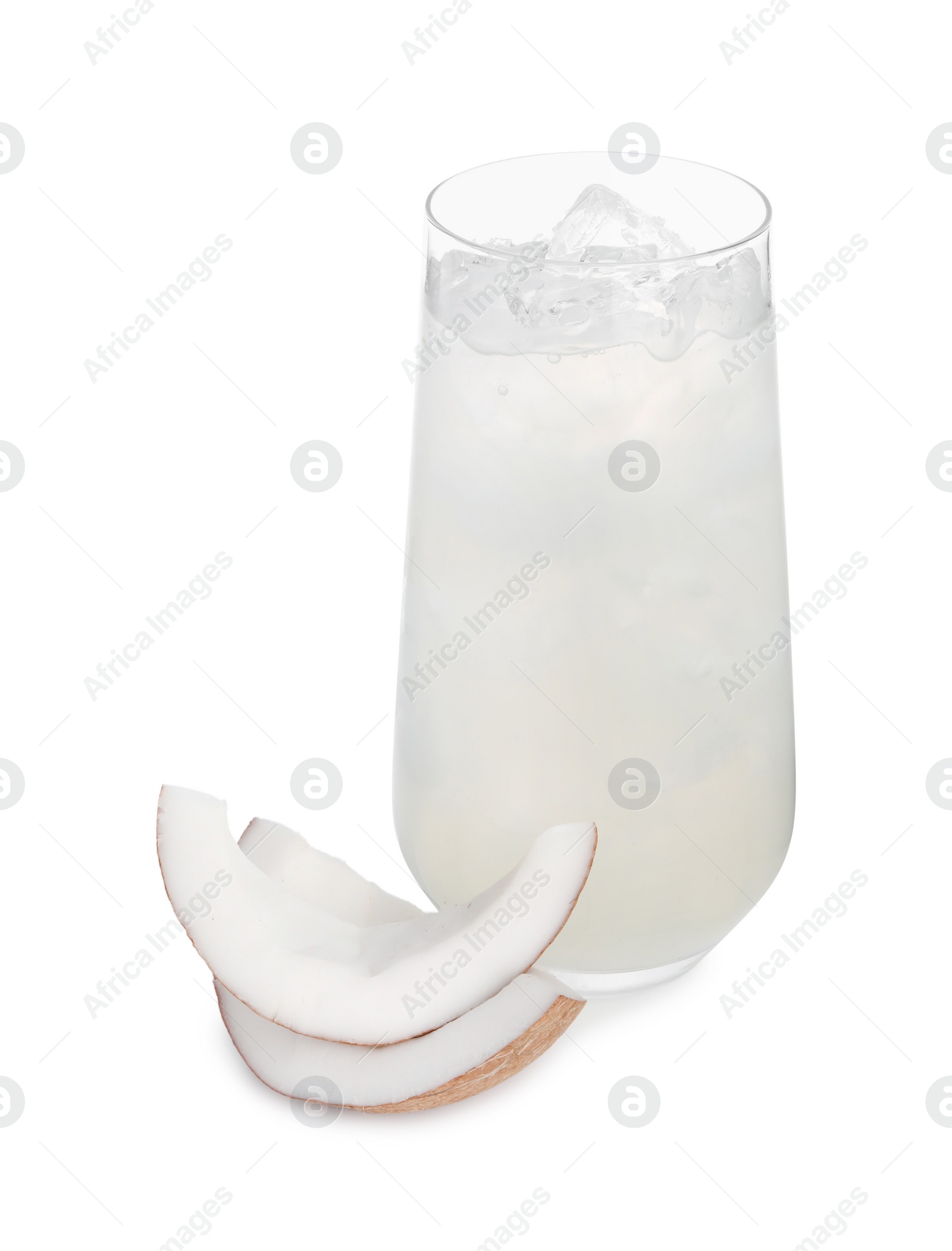 Photo of Glass of coconut water, ice cubes and nut isolated on white