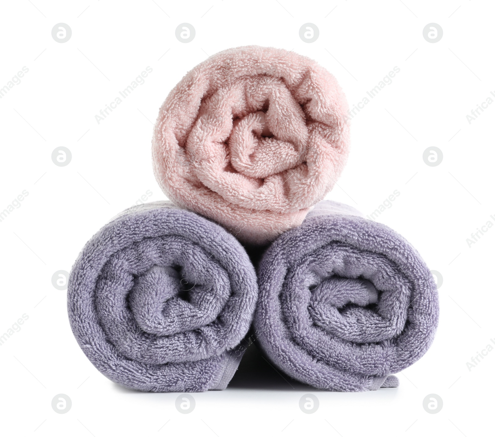 Photo of Fresh soft rolled towels isolated on white