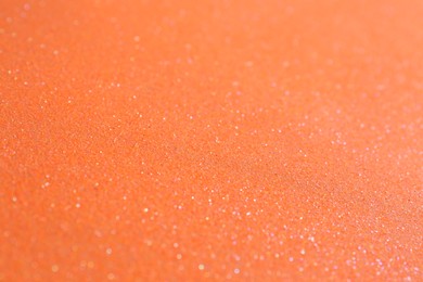 Orange textured surface as background, closeup view