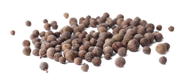 Photo of Heap of black pepper grains isolated on white