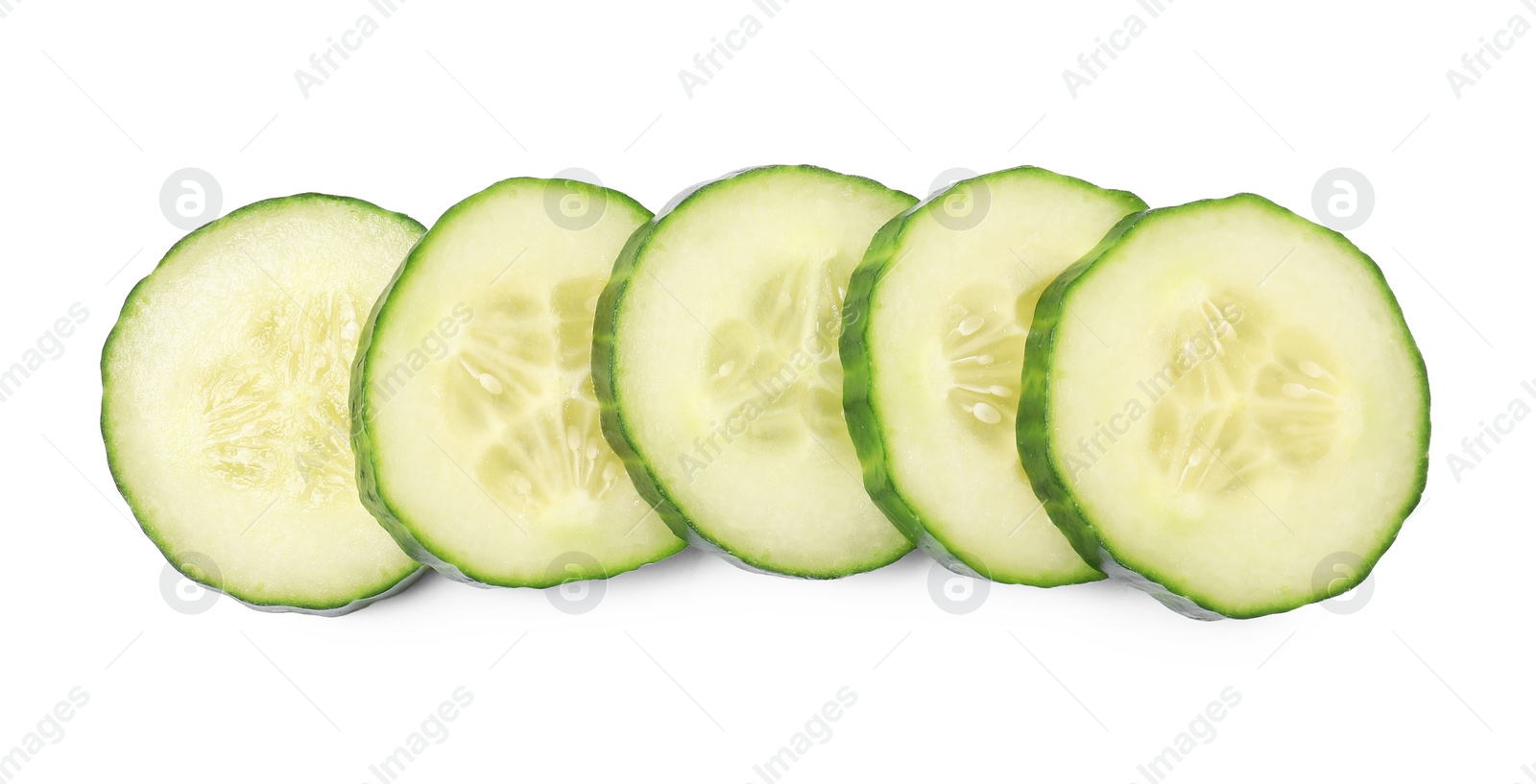 Photo of Slices of fresh cucumber isolated on white, top view