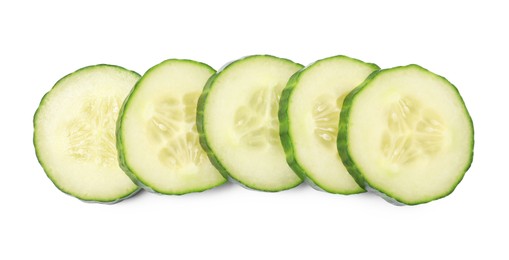 Photo of Slices of fresh cucumber isolated on white, top view