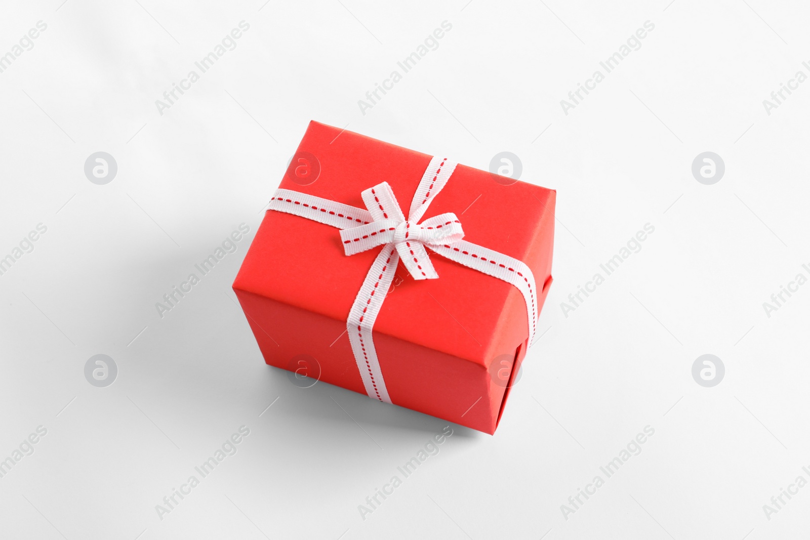 Photo of Beautifully wrapped gift box on white background