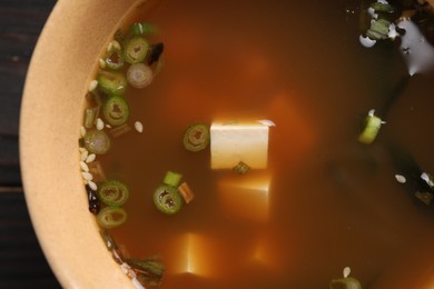 Photo of Bowl of delicious miso soup with tofu, top view
