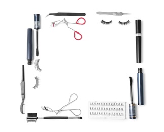 Photo of Flat lay composition with false eyelashes and cosmetic tools on white background