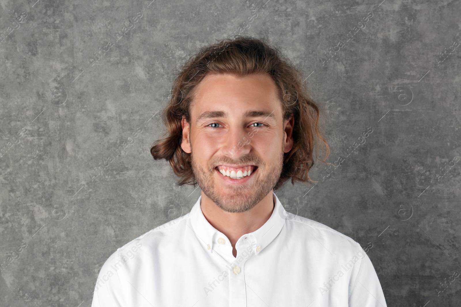 Photo of Portrait of handsome man on color background