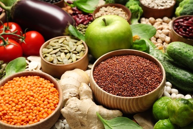 Photo of Different vegetables, seeds and fruits as background, closeup. Healthy diet