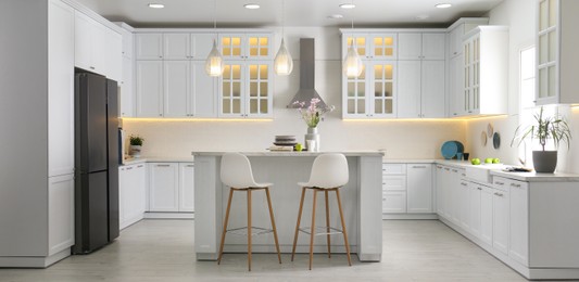 Image of Modern kitchen interior with stylish white furniture