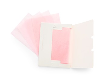 Photo of Package with facial oil blotting tissues on white background, top view. Mattifying wipes