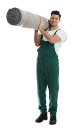 Male worker with rolled carpet on white background