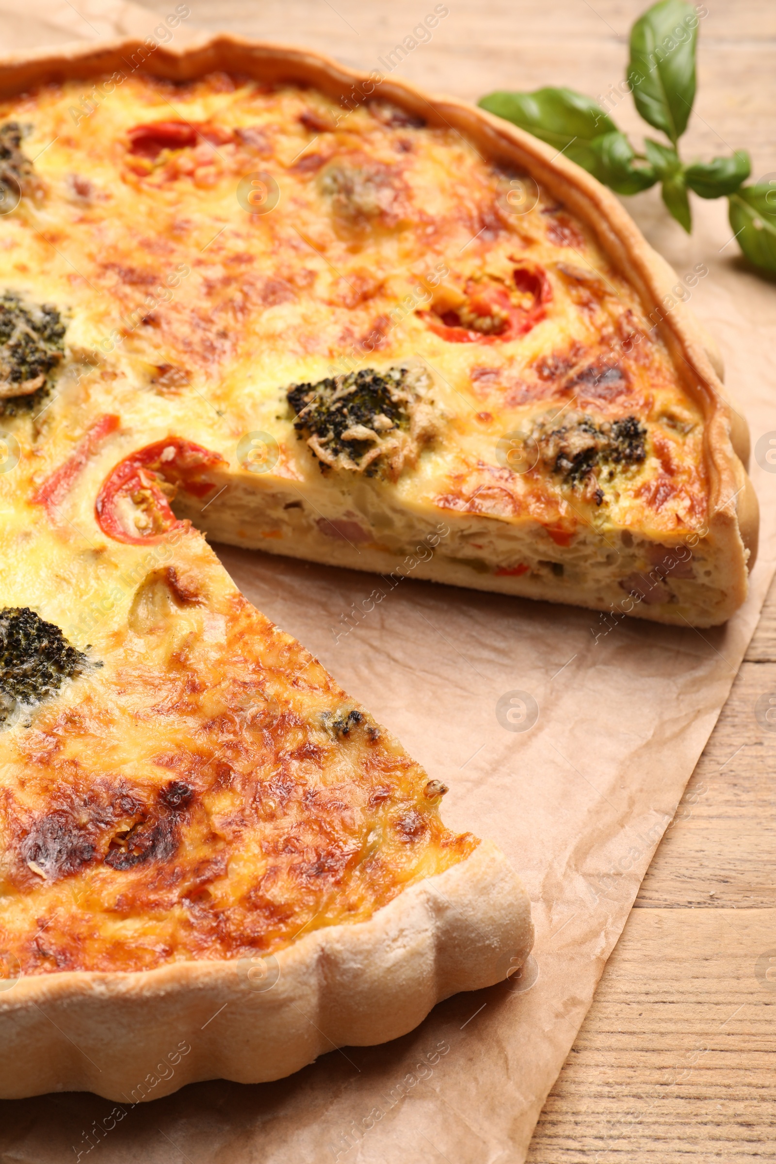 Photo of Delicious homemade vegetable quiche on table, closeup