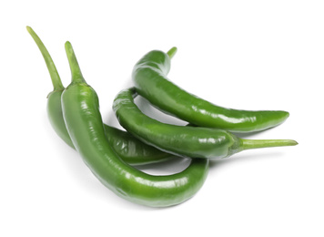 Photo of Green hot chili peppers on white background