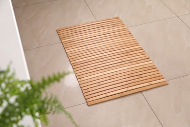 Wooden mat on floor in bathroom. Interior design