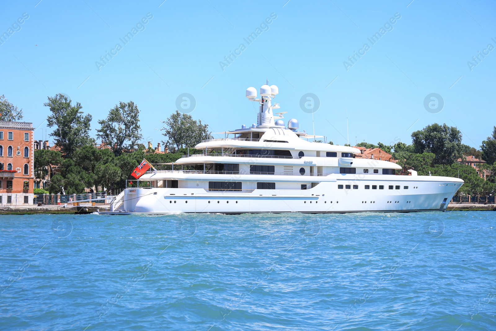 Photo of VENICE, ITALY - JUNE 13, 2019: Modern motor ship moored near shore