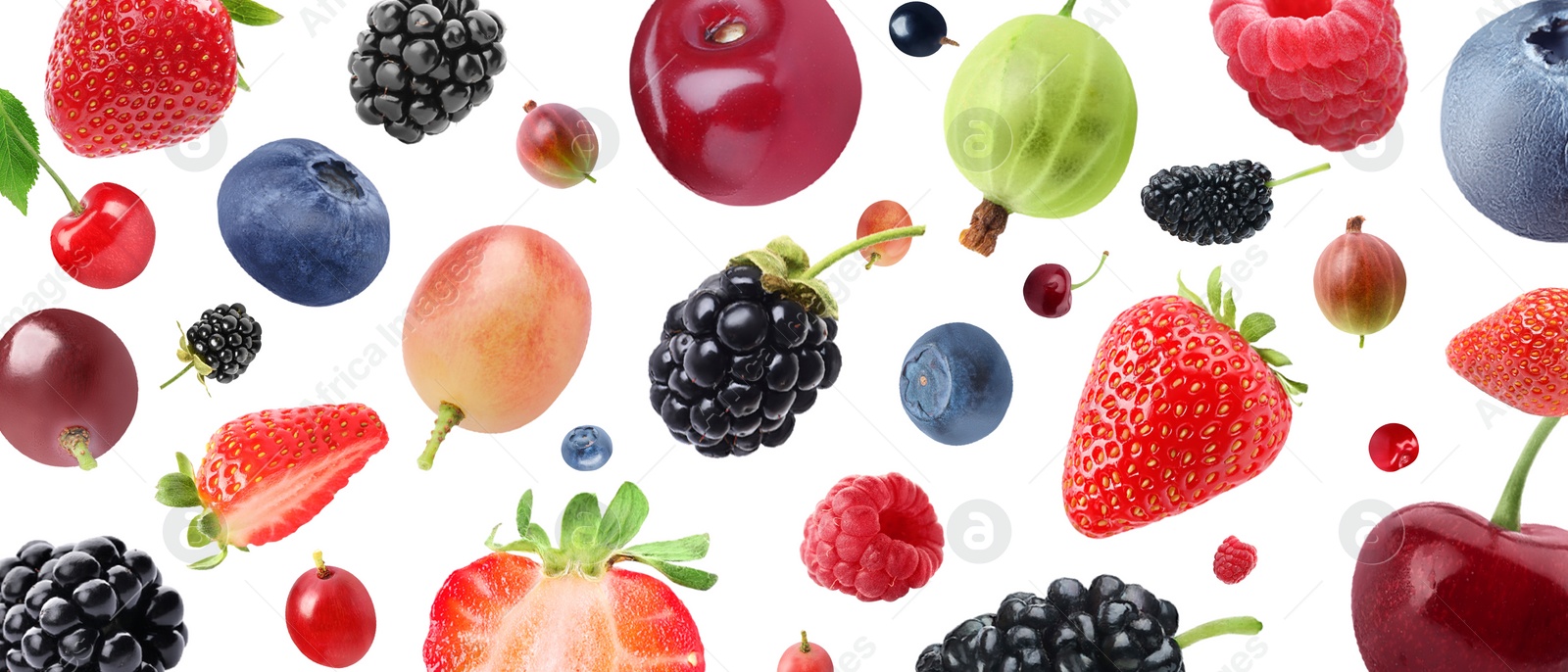 Image of Many different fresh berries falling on white background