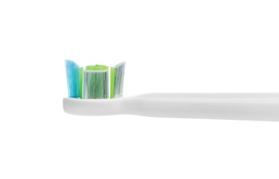 Electric toothbrush on white background, closeup view