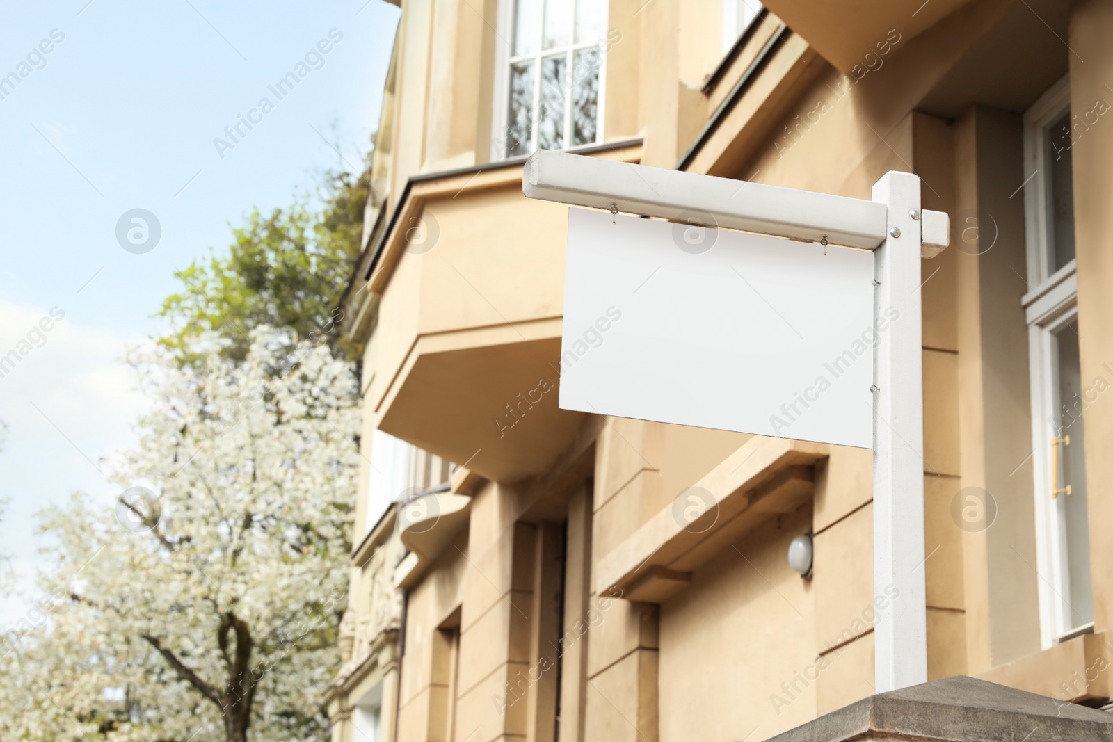 Photo of Blank advertising board on city street. Mockup for design