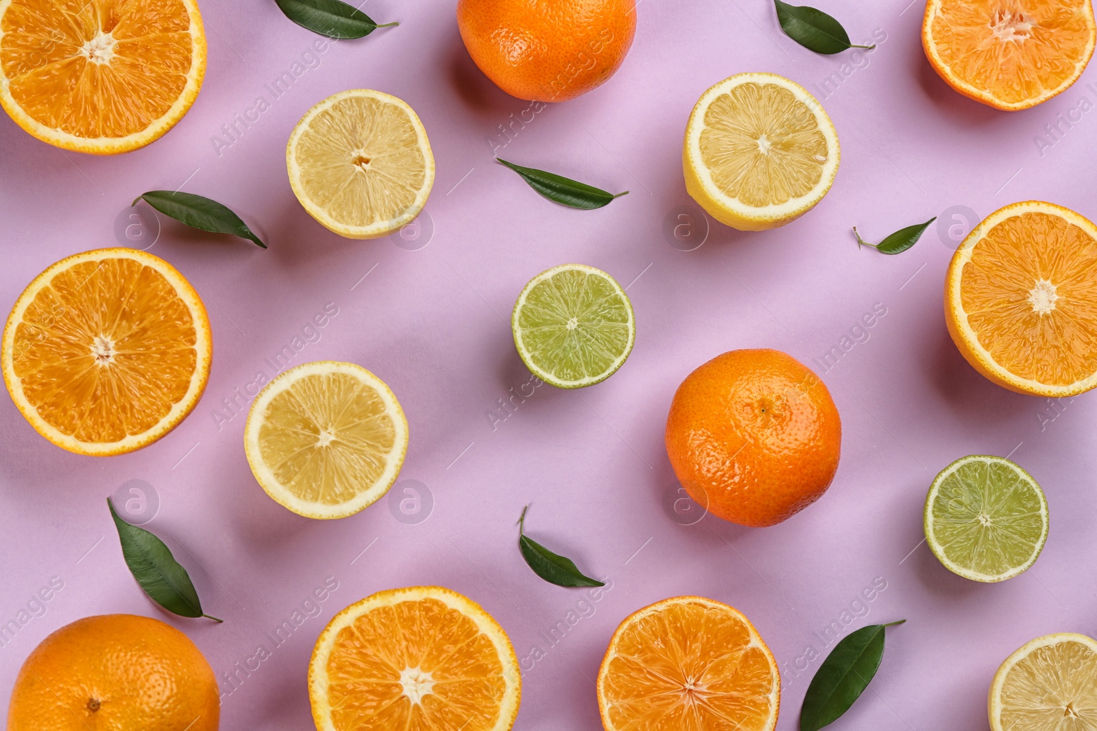 Photo of Flat lay composition with tangerines and different citrus fruits on lilac background