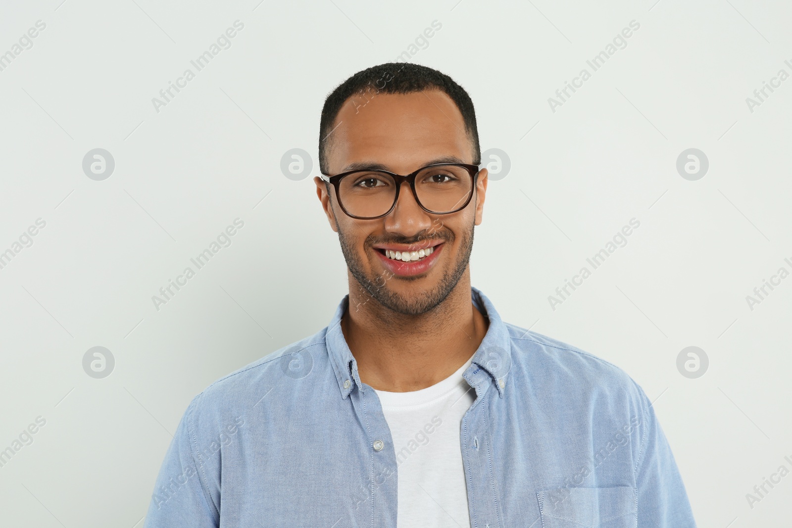 Photo of Portrait of handsome young man on white background