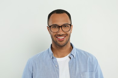 Photo of Portrait of handsome young man on white background