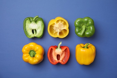 Flat lay composition with raw ripe paprika peppers on color background