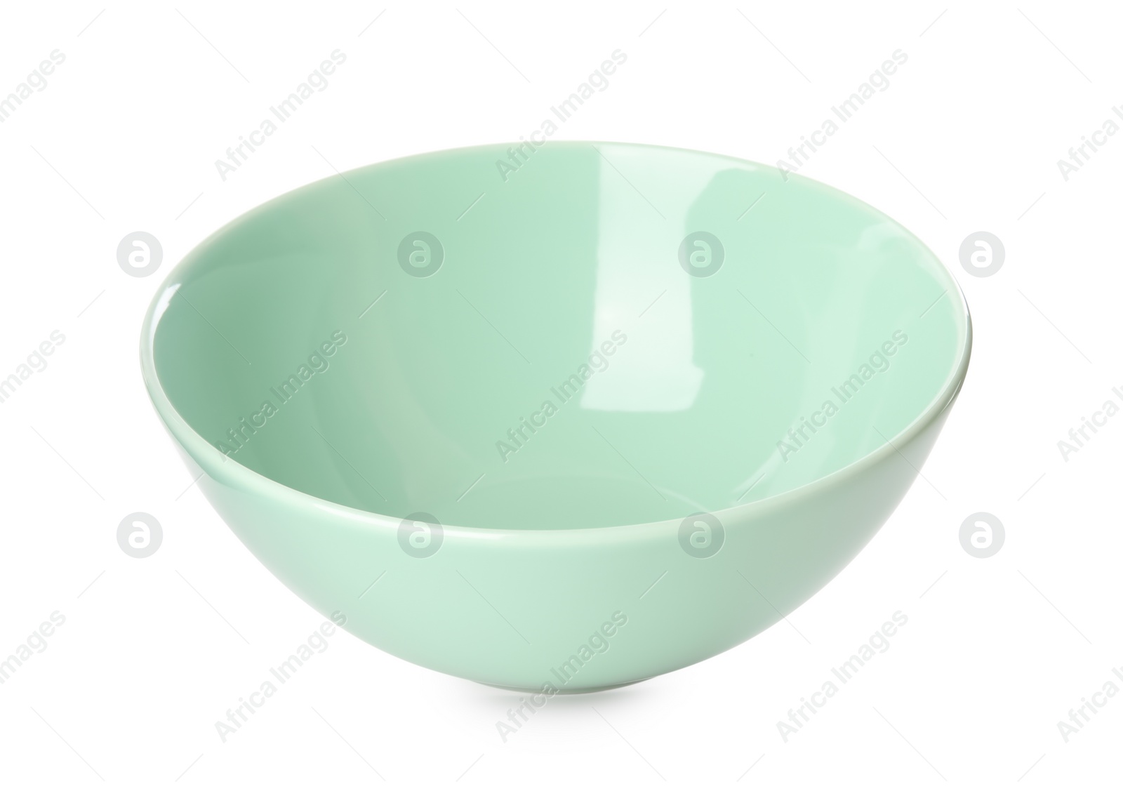 Photo of Clean light green bowl isolated on white