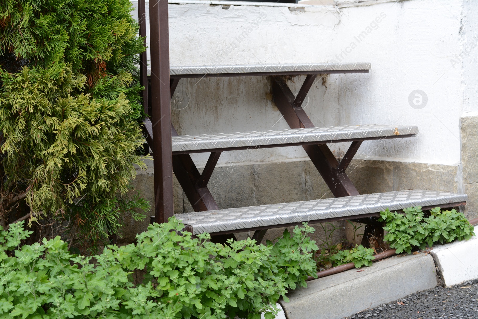 Photo of View of empty metal stairs with railing outdoors