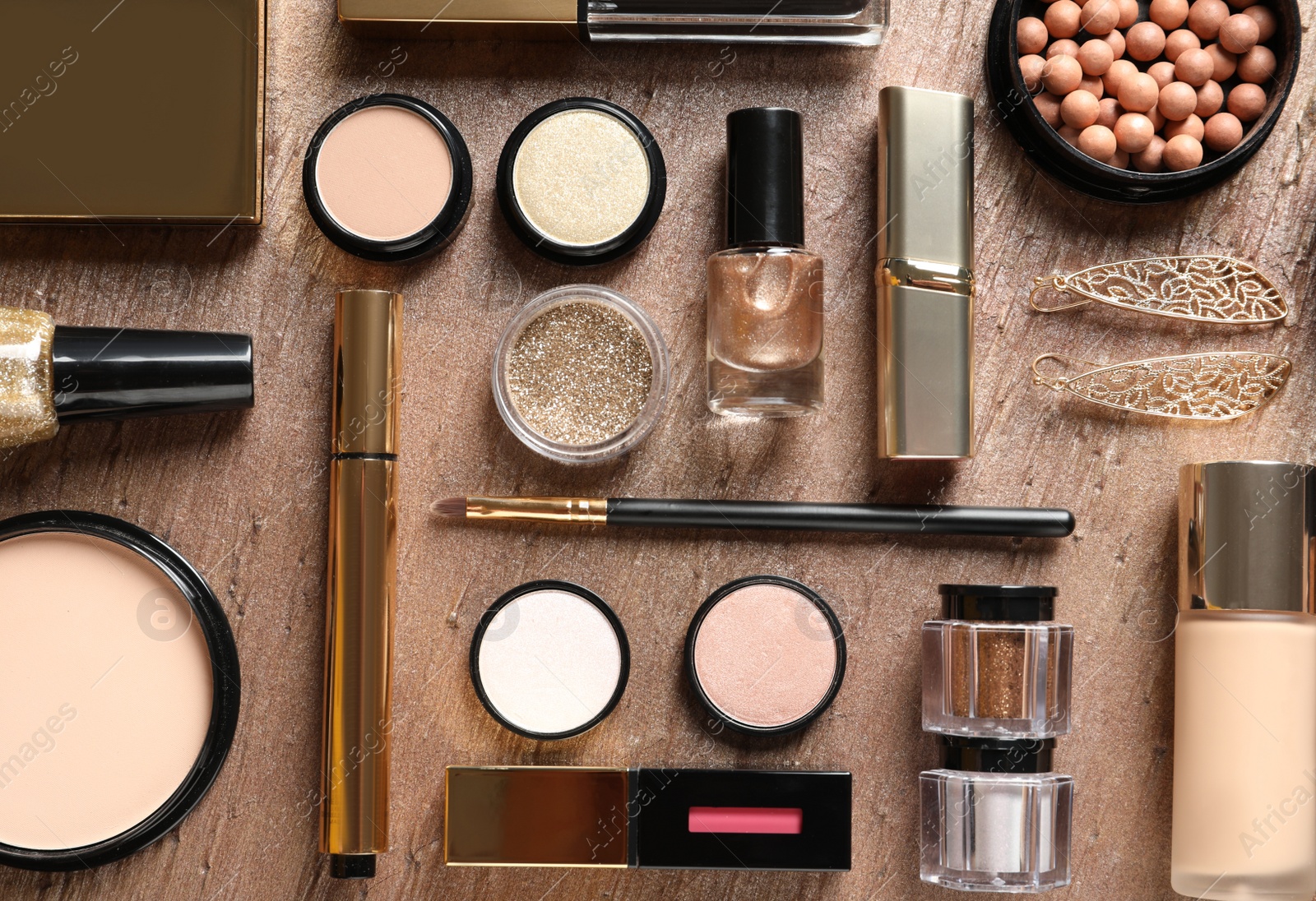 Photo of Set of luxury makeup products on color background, flat lay