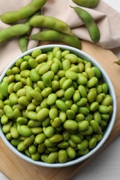 Organic edamame beans on table, flat lay