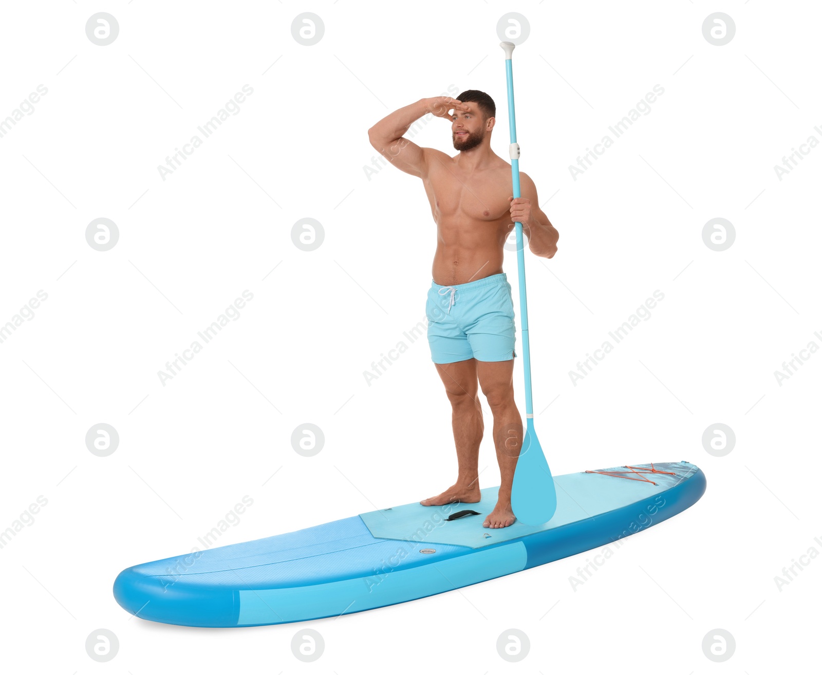 Photo of Handsome man with paddle on blue SUP board against white background