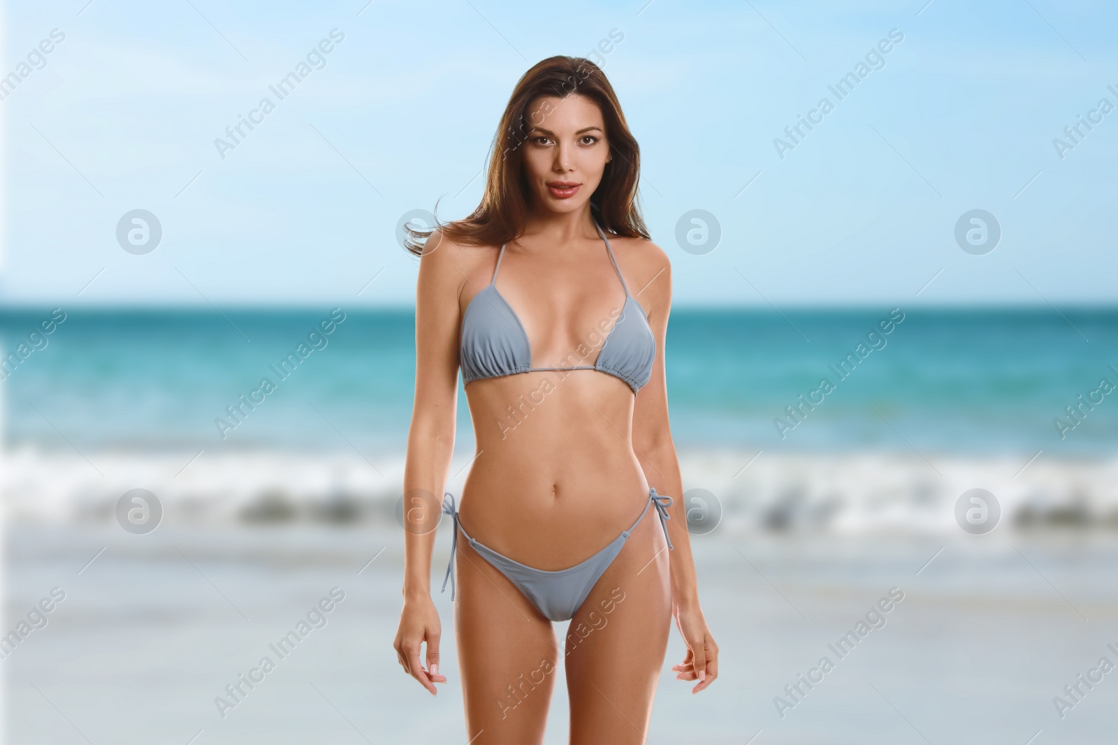 Image of Beautiful woman in stylish bikini near sea 