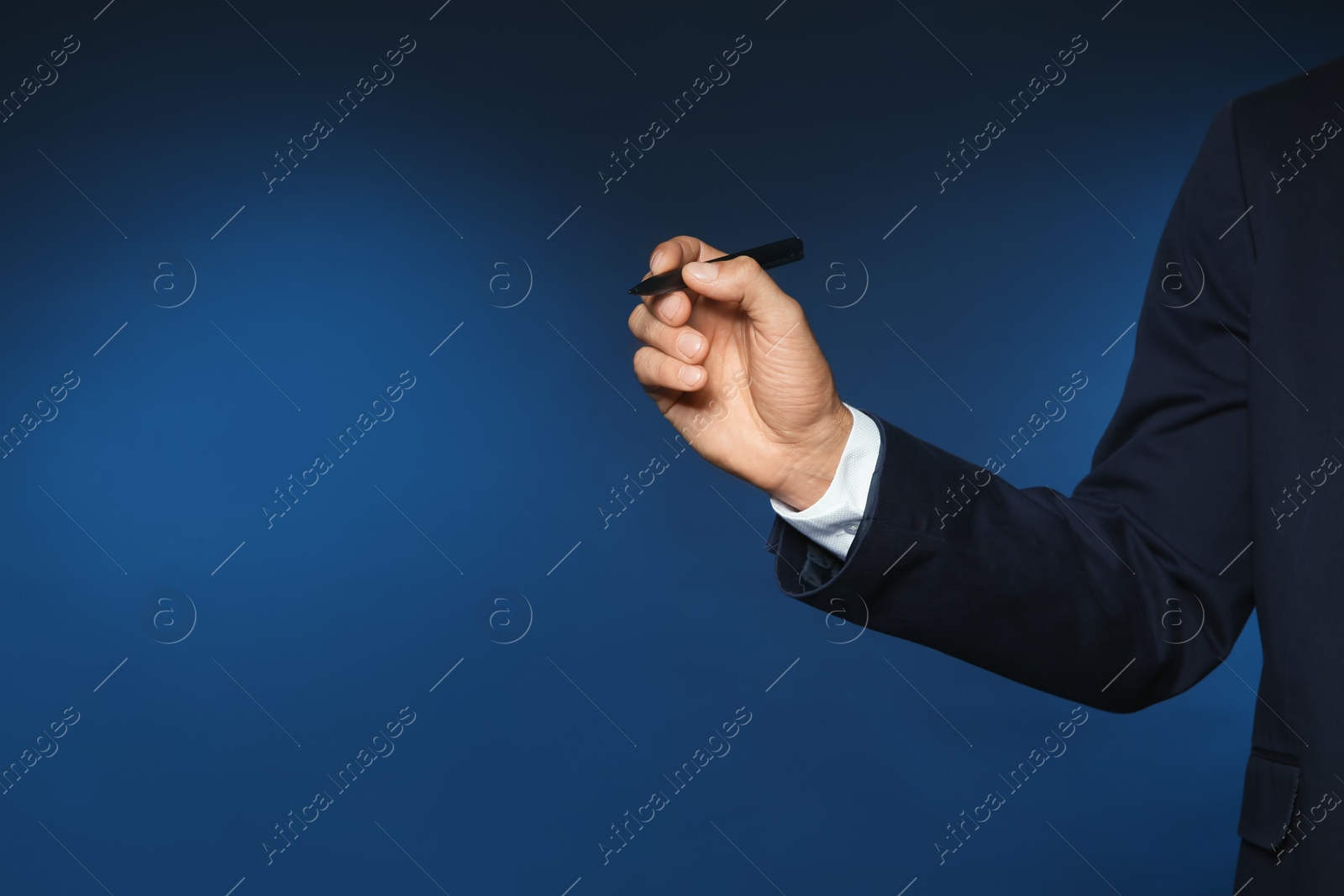 Photo of Businessman writing against color background, closeup view of hand with space for text