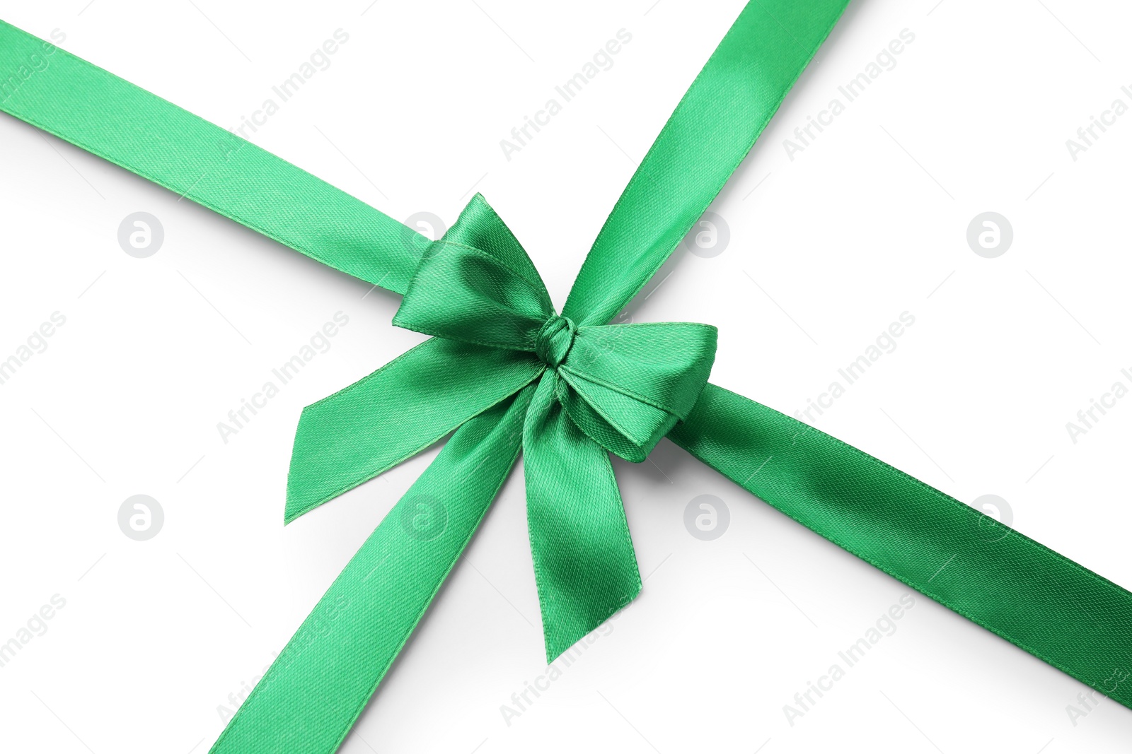 Photo of Green satin ribbon with bow isolated on white, top view