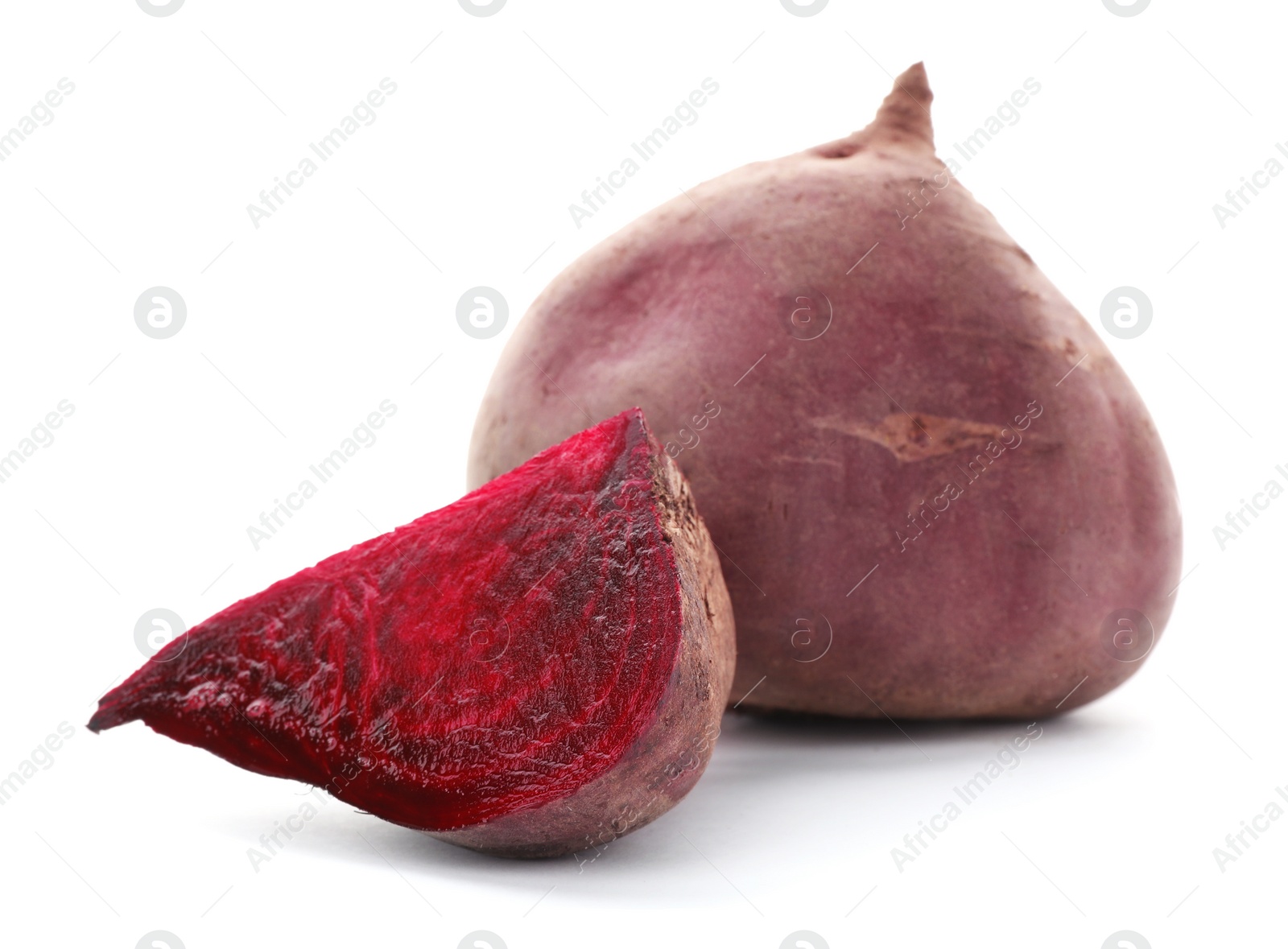 Photo of Cut and whole beets on white background. Taproot vegetable