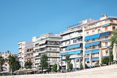 Photo of Picturesque view of city with beautiful buildings on sunny day