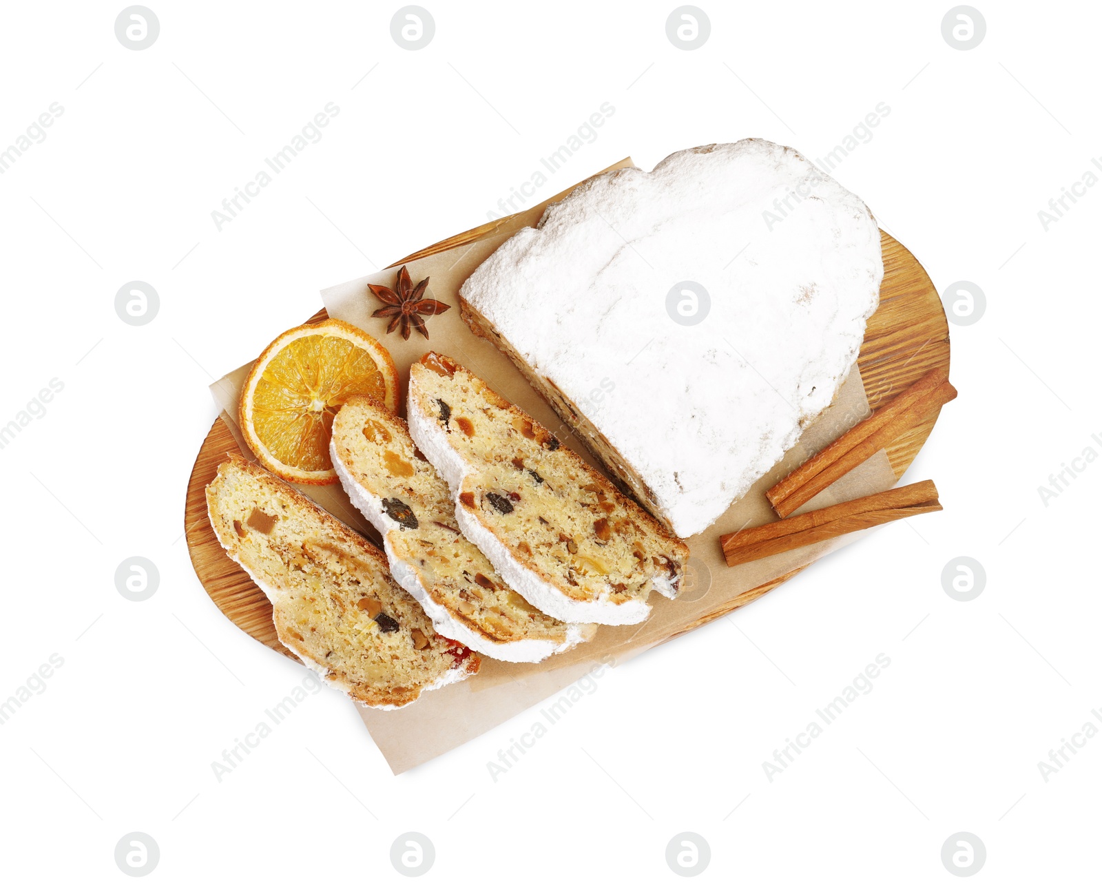 Photo of Traditional Christmas Stollen with icing sugar on white background, top view