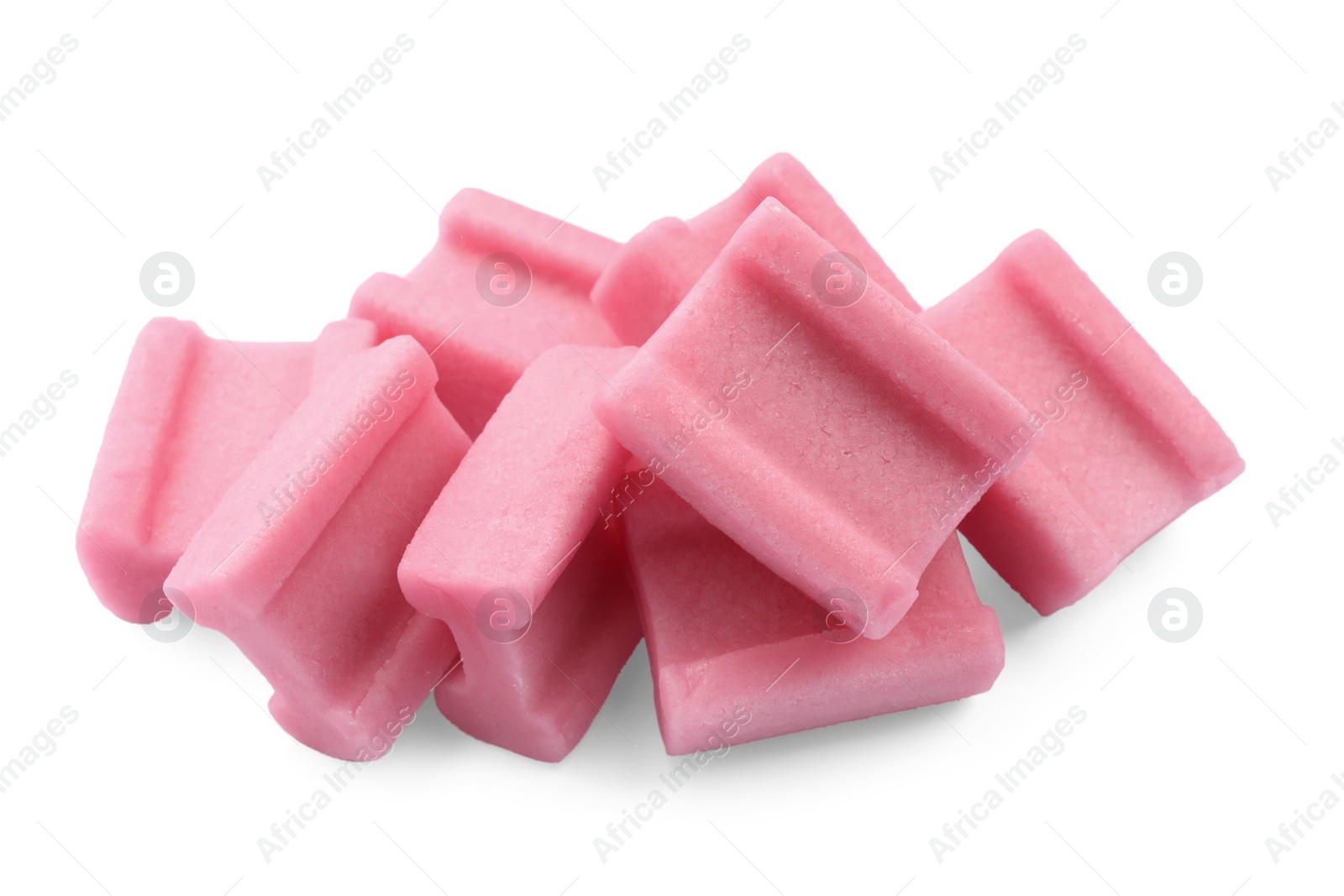 Photo of Pile of tasty pink chewing gums on white background