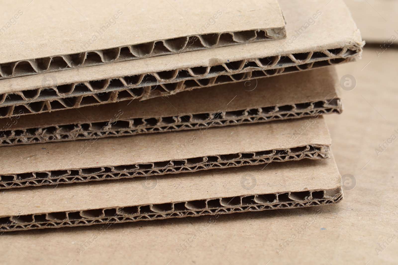 Photo of Sheets of brown corrugated cardboard, closeup view