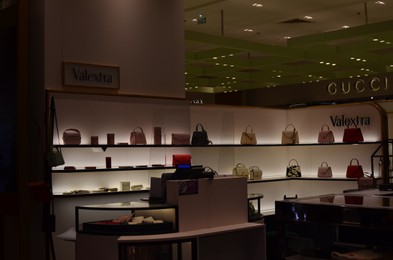 Paris, France - December 10, 2022: Valextra store display with different bags