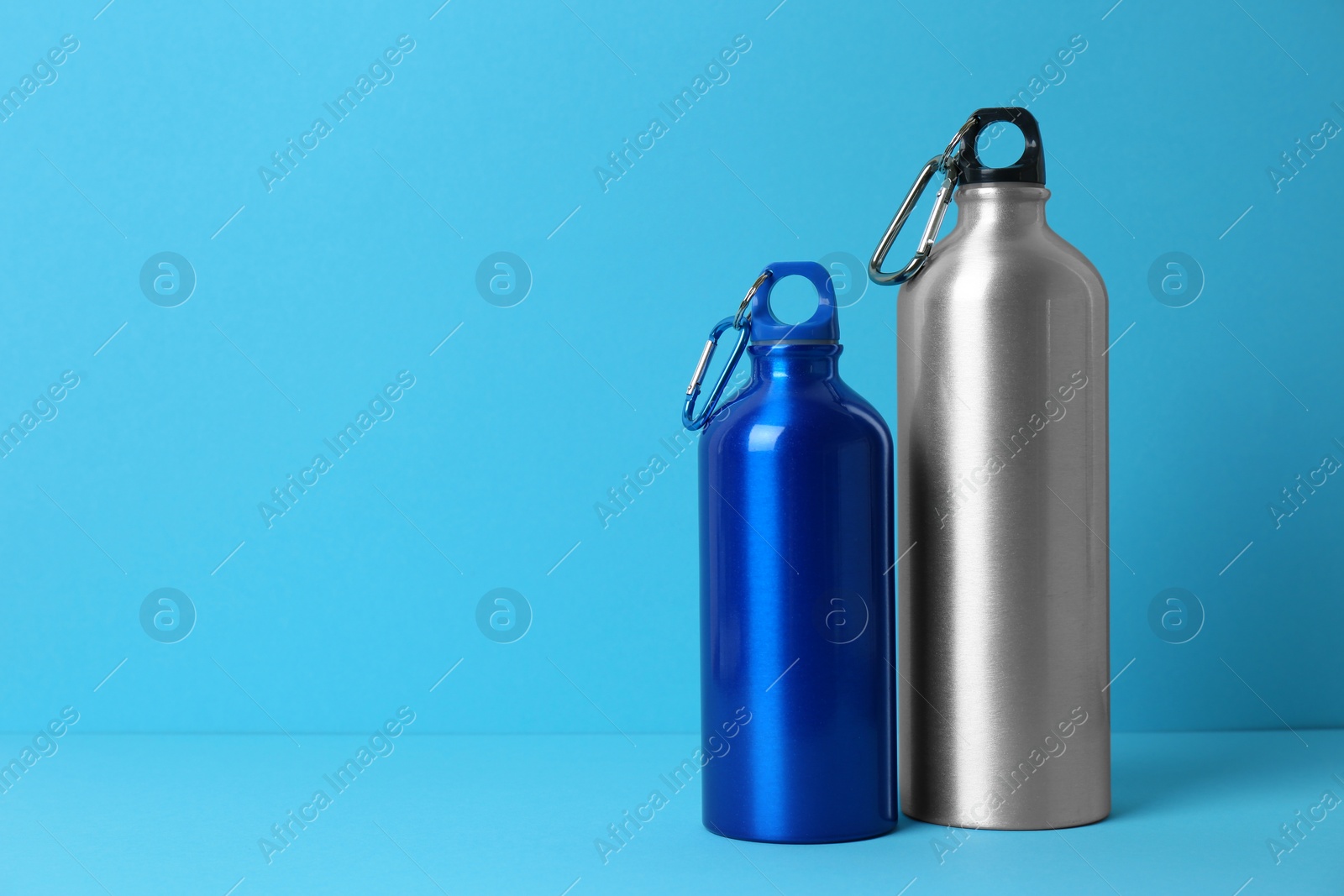 Photo of Sport bottles with space for text on color background