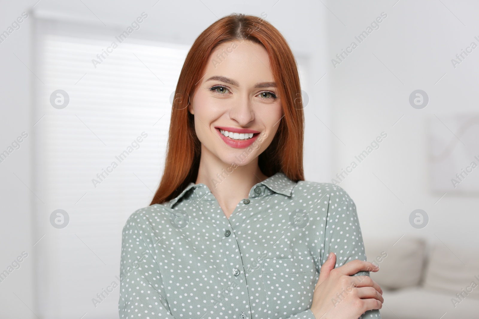 Photo of Portrait of beautiful young woman at home