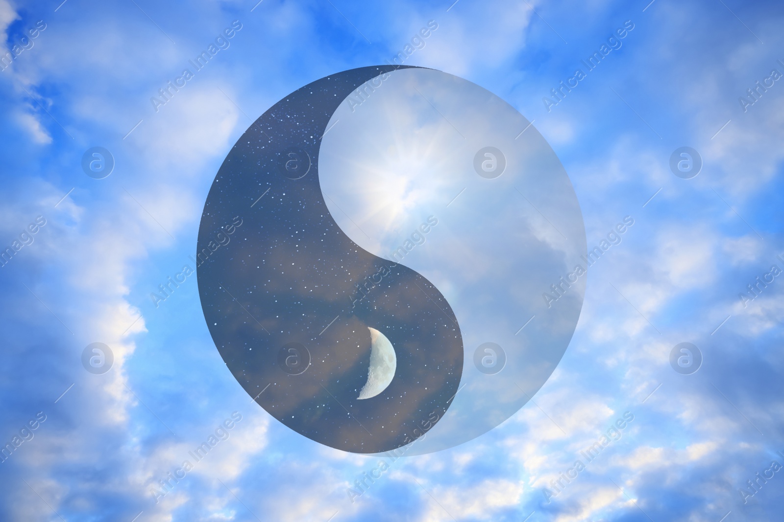 Image of Ying Yang symbol against blue sky. Feng Shui philosophy