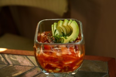 Delicious campechana cocktail with shrimps on table, closeup