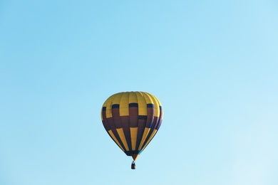 Photo of Colorful hot air balloon flying in blue sky